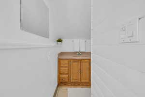 Bathroom featuring vanity and tile patterned floors