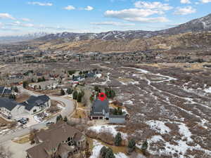 Snowy aerial view with a mountain view