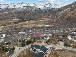 Snowy aerial view featuring a mountain view