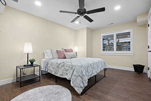 Bedroom featuring ceiling fan and dark hardwood / wood-style floors