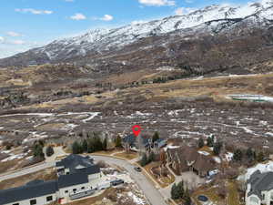 Snowy aerial view with a mountain view