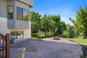View of patio / terrace with an outdoor fire pit
