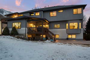 View of snow covered rear of property