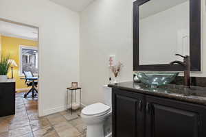 Bathroom featuring vanity and toilet