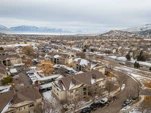 Snowy aerial view featuring a mountain view