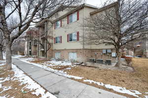 View of front of house featuring central AC unit