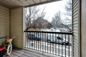 View of snow covered back of property