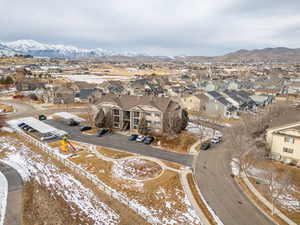 Snowy aerial view featuring a mountain view