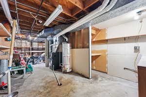 Basement with heating unit and secured water heater. Could be a great place to add a second laundry.