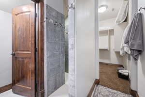 Bathroom featuring tiled shower