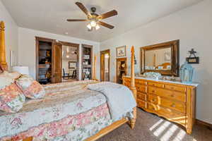 Carpeted bedroom with ceiling fan