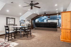 Interior space with lofted ceiling and carpet floors