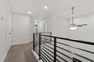 Dramatic upper hallway with beautiful railing