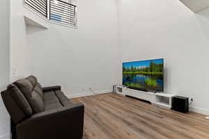 Living room with light hardwood / wood-style flooring