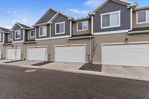 View of property with a garage