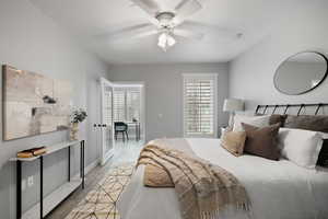 Bedroom with light hardwood / wood-style flooring and ceiling fan