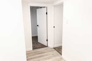 Hallway featuring light wood-type flooring