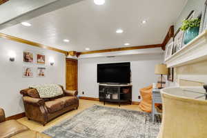 Living room featuring crown molding