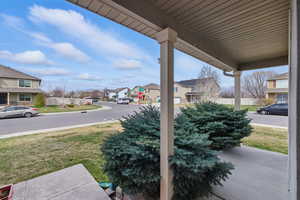 View of patio with a residential view and a porch