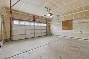 Garage featuring a garage door opener