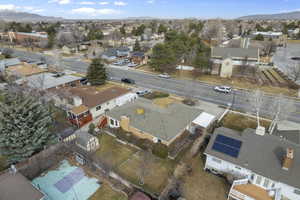 Birds eye view of property featuring a mountain view