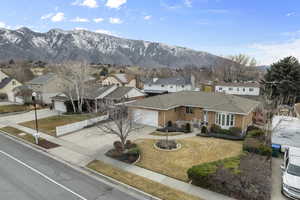 View of front of house featuring a garage and a mountain view