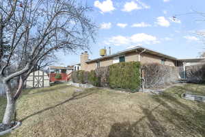 Exterior space featuring a shed