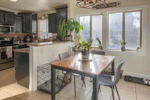 Tiled dining room with a wealth of natural light