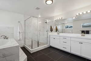 Bathroom with vanity and independent shower and bath