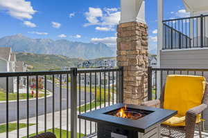 Balcony with an outdoor fire pit and a mountain view