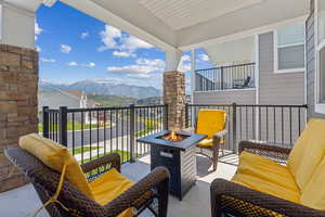 Balcony featuring a mountain view and a fire pit