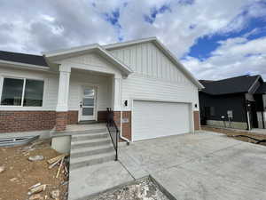 View of front of property featuring a garage