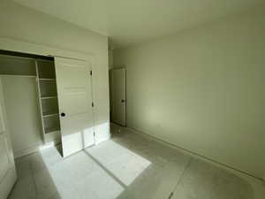 Unfurnished bedroom featuring a closet