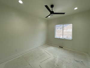 Unfurnished room featuring ceiling fan