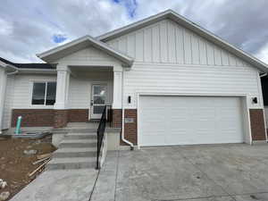 View of front of property featuring a garage