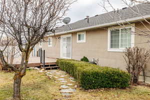 Back of property featuring a deck