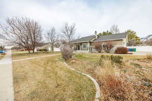 Ranch-style house with a front lawn