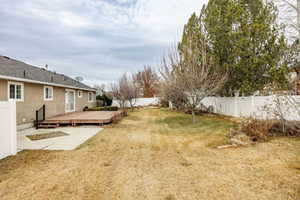 View of yard featuring a wooden deck