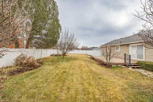 View of yard featuring a wooden deck