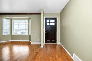 Foyer entrance with hardwood flooring