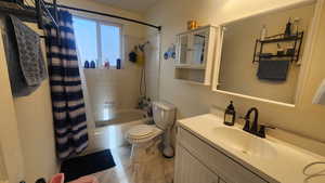 Upstairs Full bathroom with shower / tub combo with curtain, vanity, and toilet