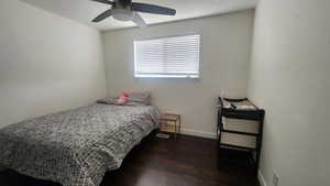 Upstairs Bedroom #1 featuring ceiling fan and dark hardwood / wood-style flooring