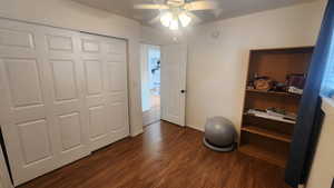 Upstairs bedroom #2 dark hardwood / wood-style floors and ceiling fan