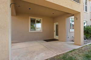 Property entrance with a patio area