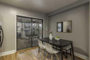 Dining space with light wood-type flooring