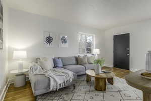 Living room with light hardwood / wood-style floors