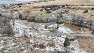 Snowy aerial view with a rural view