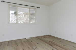 Empty room featuring light hardwood / wood-style floors