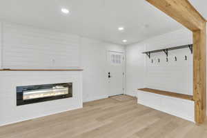 Mudroom with light hardwood / wood-style floors