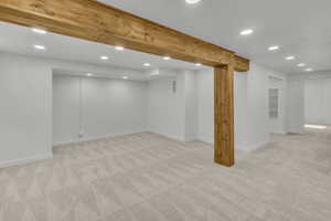 Basement with light carpet